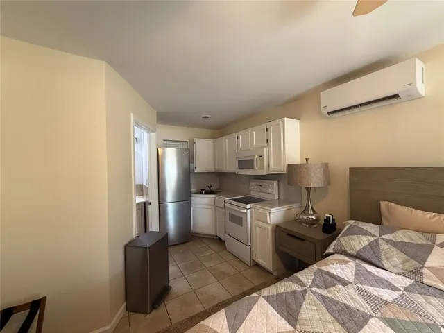 a kitchen with a sink appliances and cabinets