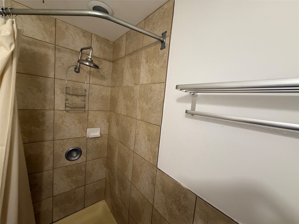4413 Nixon Lane, Unit C Austin, TX 78725 - Photo 6 of 9 a bathroom with a shower