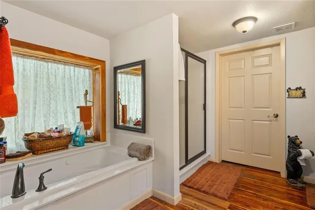 a bathroom with a tub and a sink