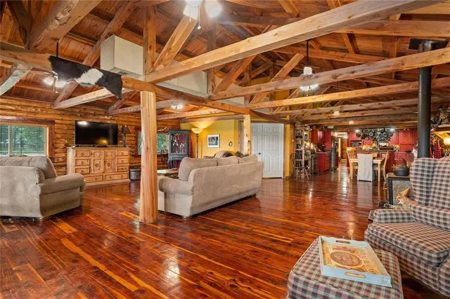 a view of a patio with couches and potted plants