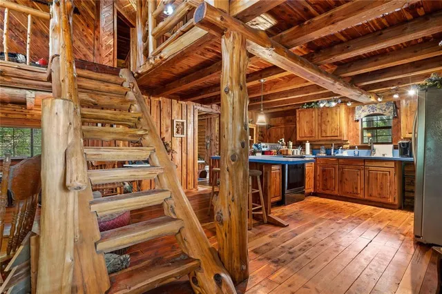 a utility room with lots of wooden furniture and a wooden floors