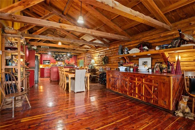 a view of a room with wooden floors