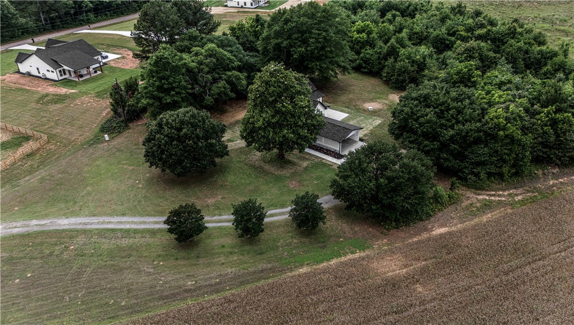 2817 Broadway Lake Road Anderson, SC 29621 - Photo 36 of 41 An aerial perspective reveals a secluded home nestled amongst mature trees on a sprawling, green property.