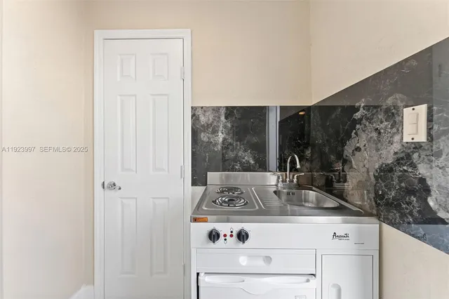 a bathroom with a sink and mirror