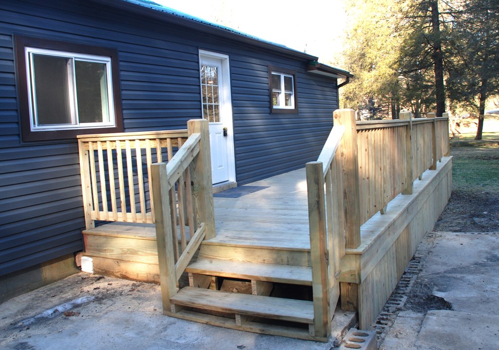 2242 Spruce Road Cherry Tree, PA 15724 - Photo 11 of 39 a view of backyard with deck and wooden floor