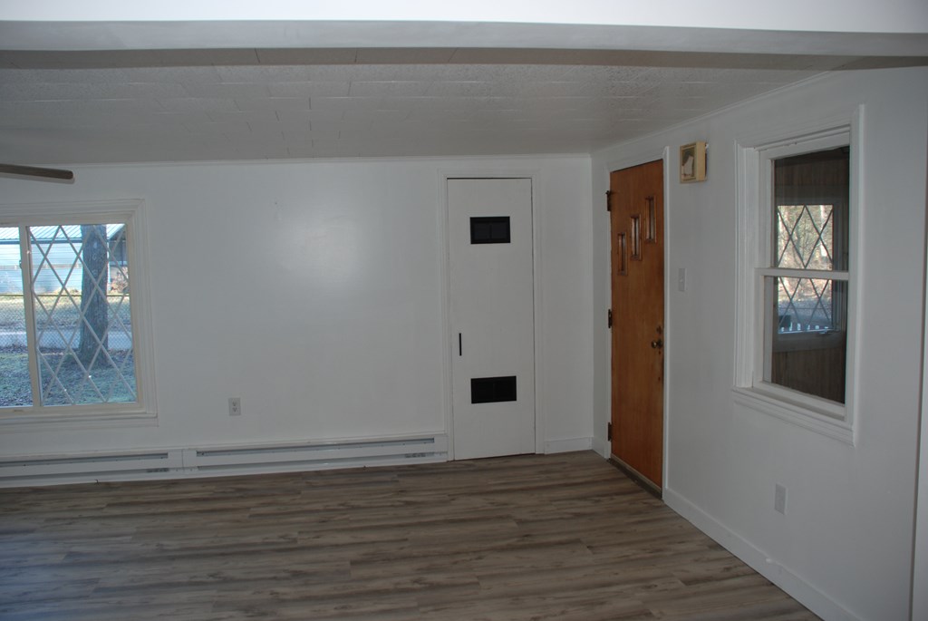 2242 Spruce Road Cherry Tree, PA 15724 - Photo 17 of 39 a view of an empty room with wooden floor and a window