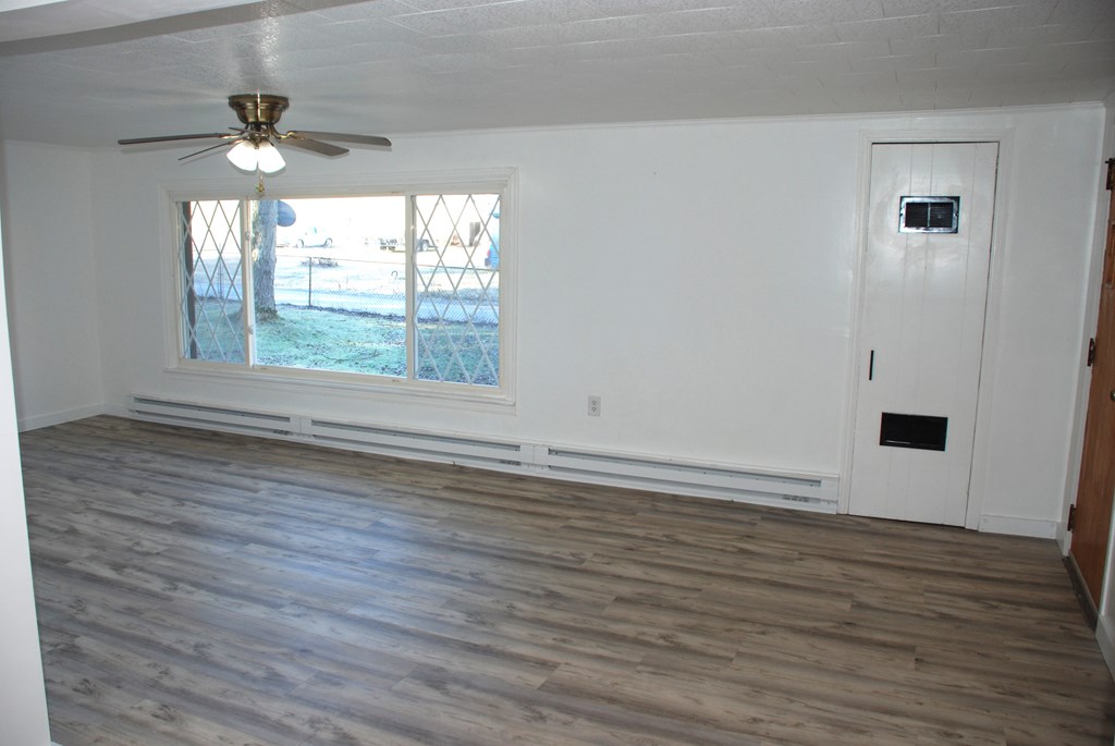 2242 Spruce Road Cherry Tree, PA 15724 - Photo 18 of 39 wooden floor in an empty room with a window