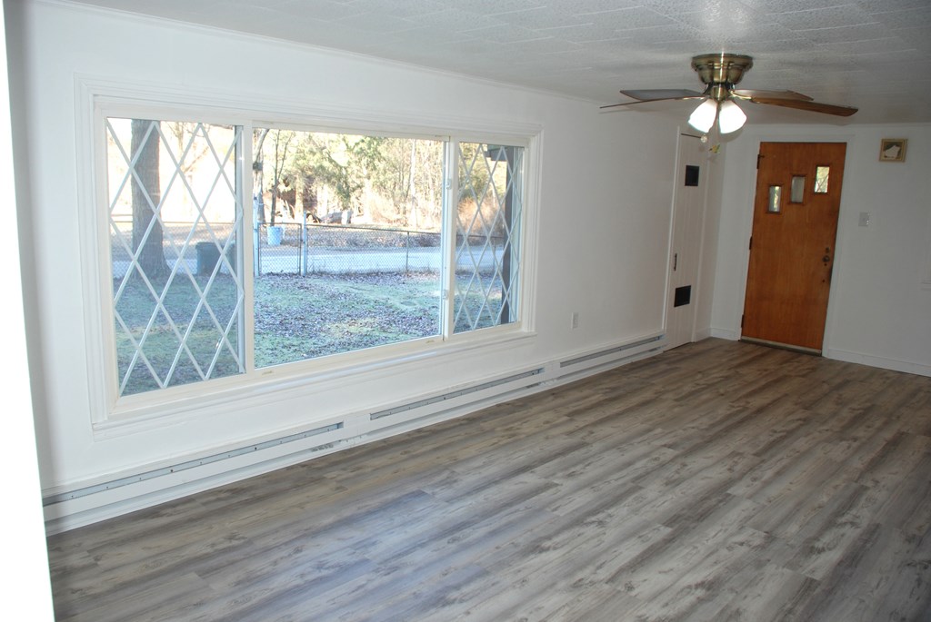2242 Spruce Road Cherry Tree, PA 15724 - Photo 20 of 39 a view of an empty room with wooden floor and a window