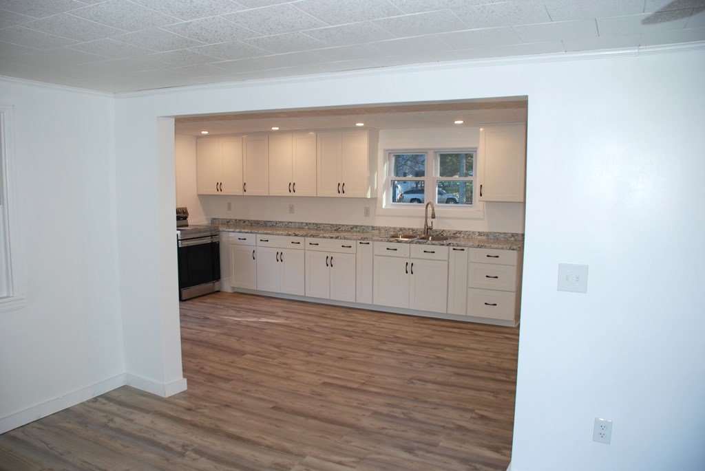 2242 Spruce Road Cherry Tree, PA 15724 - Photo 22 of 39 a spacious bathroom with a granite countertop sink and a mirror