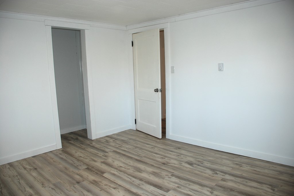 2242 Spruce Road Cherry Tree, PA 15724 - Photo 24 of 39 a view of an empty room with wooden floor
