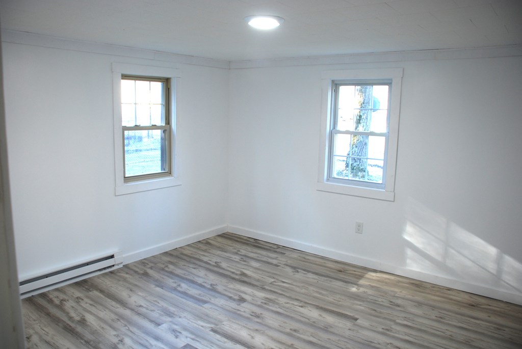 2242 Spruce Road Cherry Tree, PA 15724 - Photo 26 of 39 an empty room with wooden floor and windows