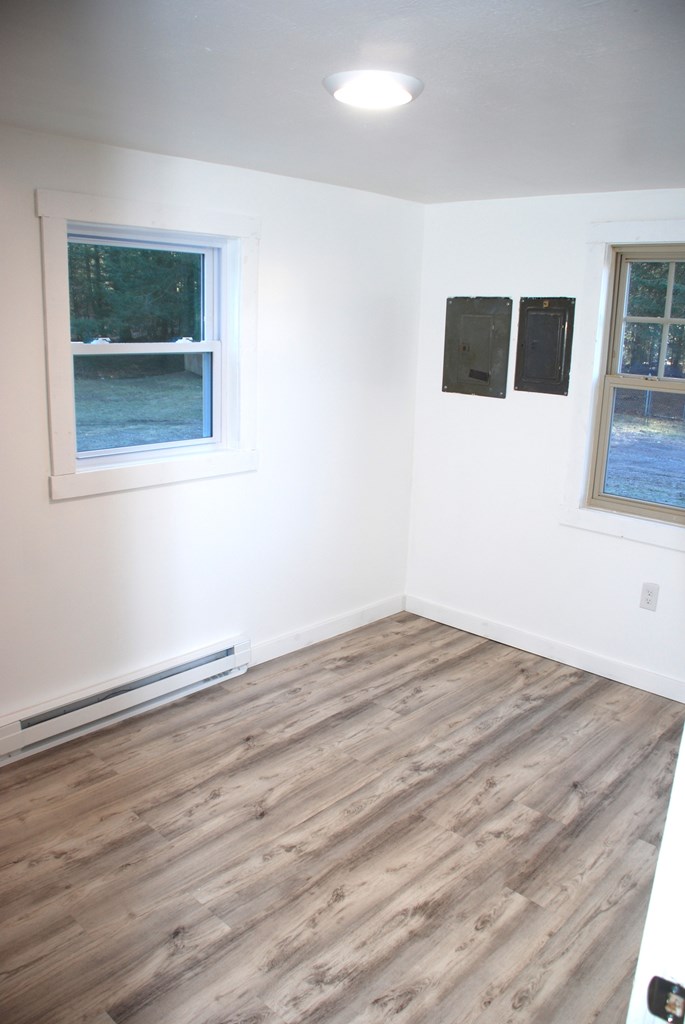 2242 Spruce Road Cherry Tree, PA 15724 - Photo 30 of 39 a view of an empty room with wooden floor and a window