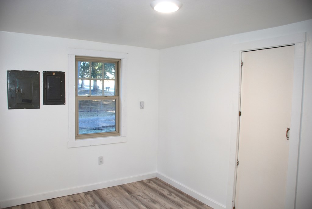 2242 Spruce Road Cherry Tree, PA 15724 - Photo 32 of 39 a view of an empty room with wooden floor and a window