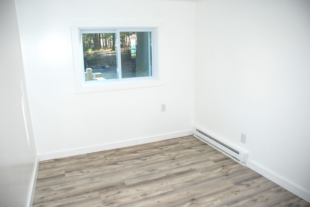 2242 Spruce Road Cherry Tree, PA 15724 - Photo 33 of 39 a view of empty room with wooden floor and fan