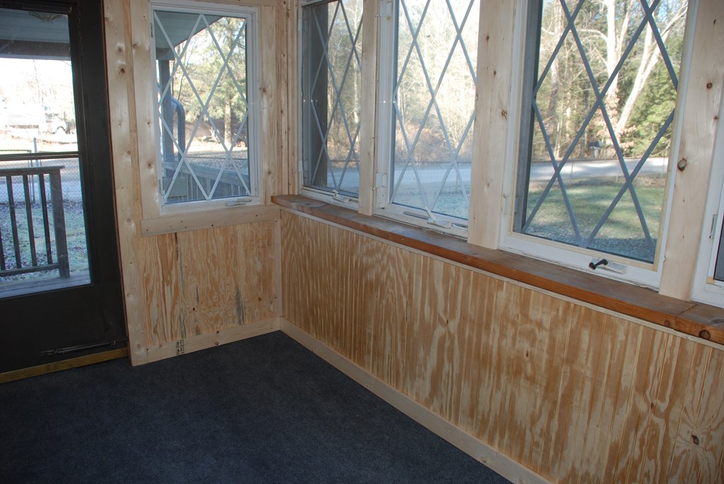 2242 Spruce Road Cherry Tree, PA 15724 - Photo 9 of 39 a view of an empty room with wooden floor and a window