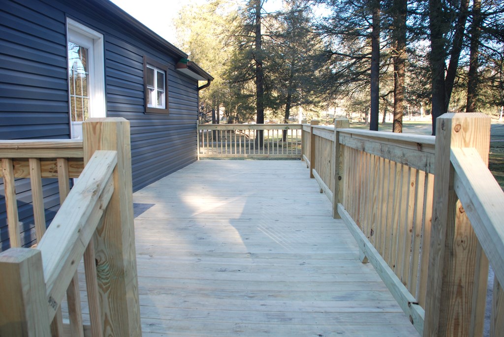 2242 Spruce Road Cherry Tree, PA 15724 - Photo 10 of 39 a view of deck with wooden floor and fence next to a yard