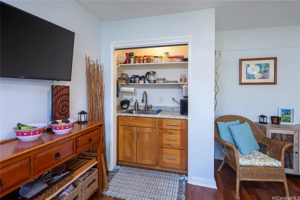 a kitchen with stainless steel appliances kitchen island granite countertop a stove a sink and a refrigerator