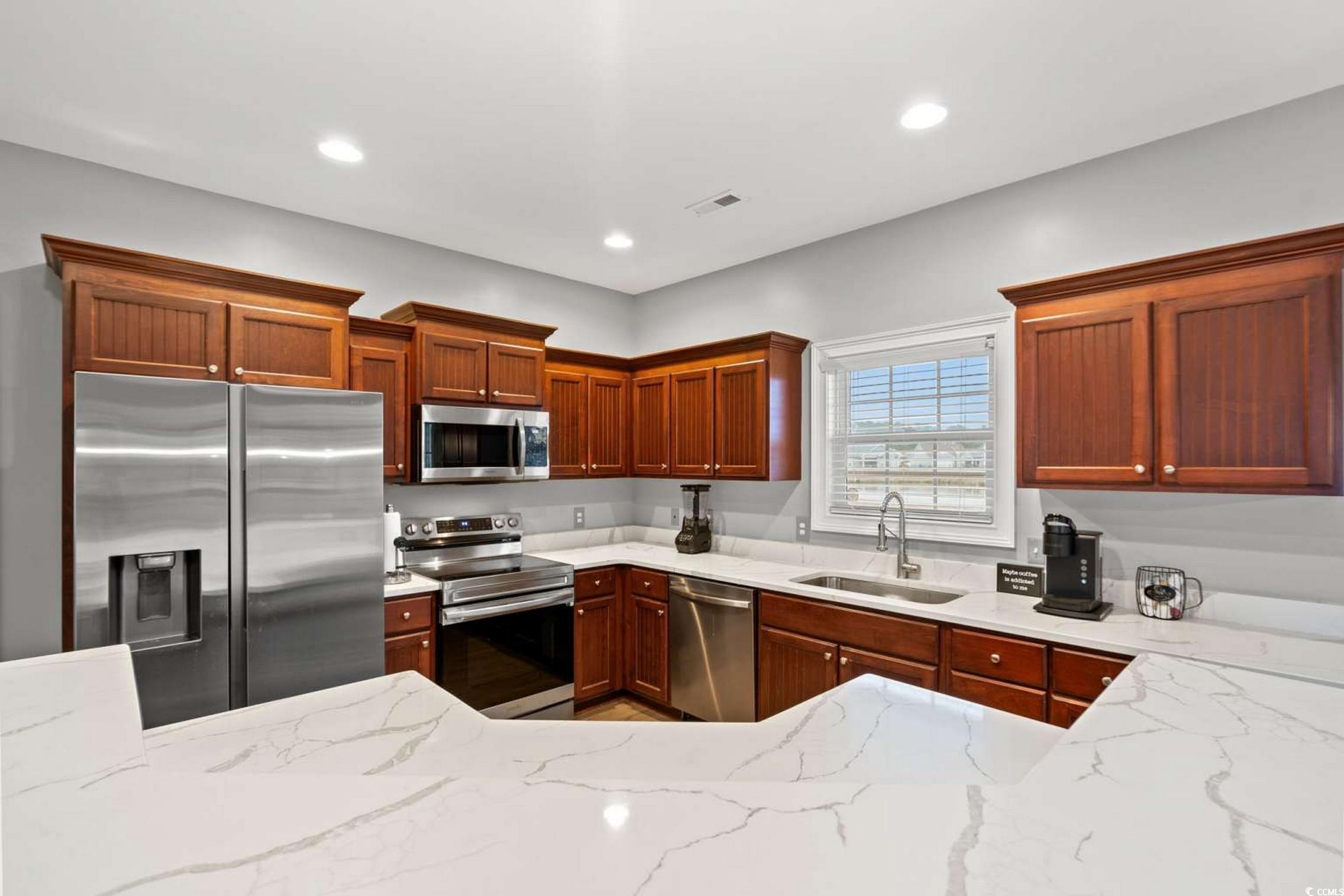 286 Copperwood Loop Conway, SC 29526 - Photo 12 of 40 Kitchen featuring appliances with stainless steel finishes, light stone counters, and recessed lighting