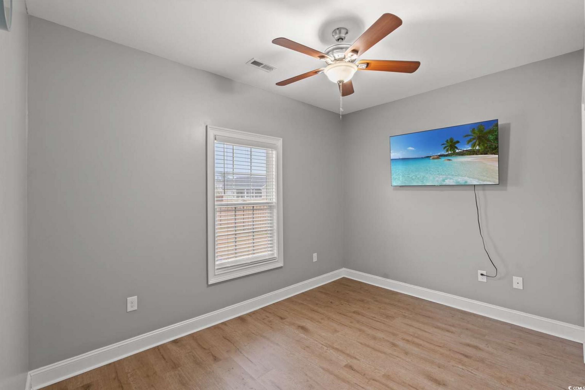 286 Copperwood Loop Conway, SC 29526 - Photo 18 of 40 Unfurnished room with light wood finished floors and ceiling fan