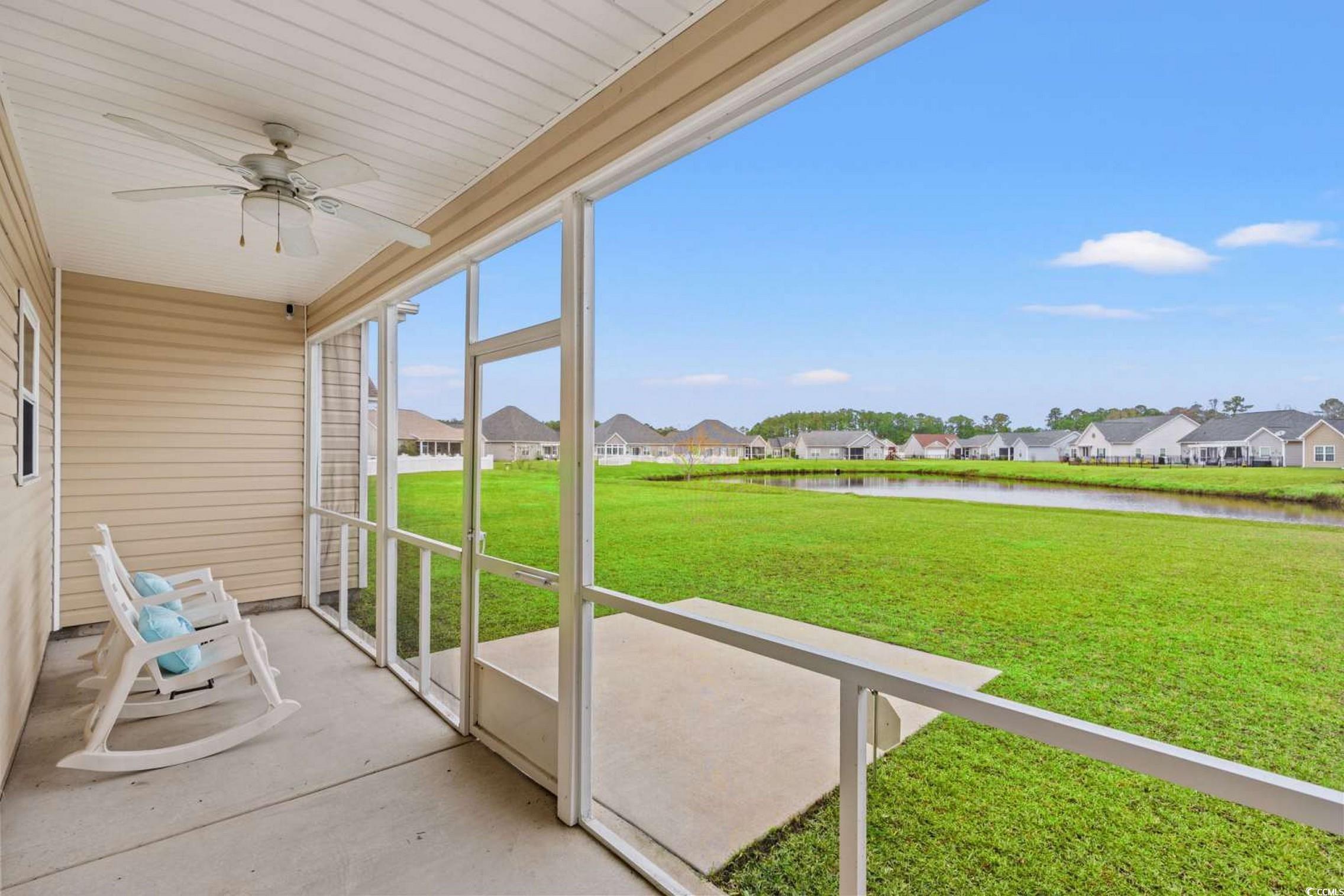 286 Copperwood Loop Conway, SC 29526 - Photo 25 of 40 Unfurnished sunroom featuring ceiling fan, a residential view, and a water view