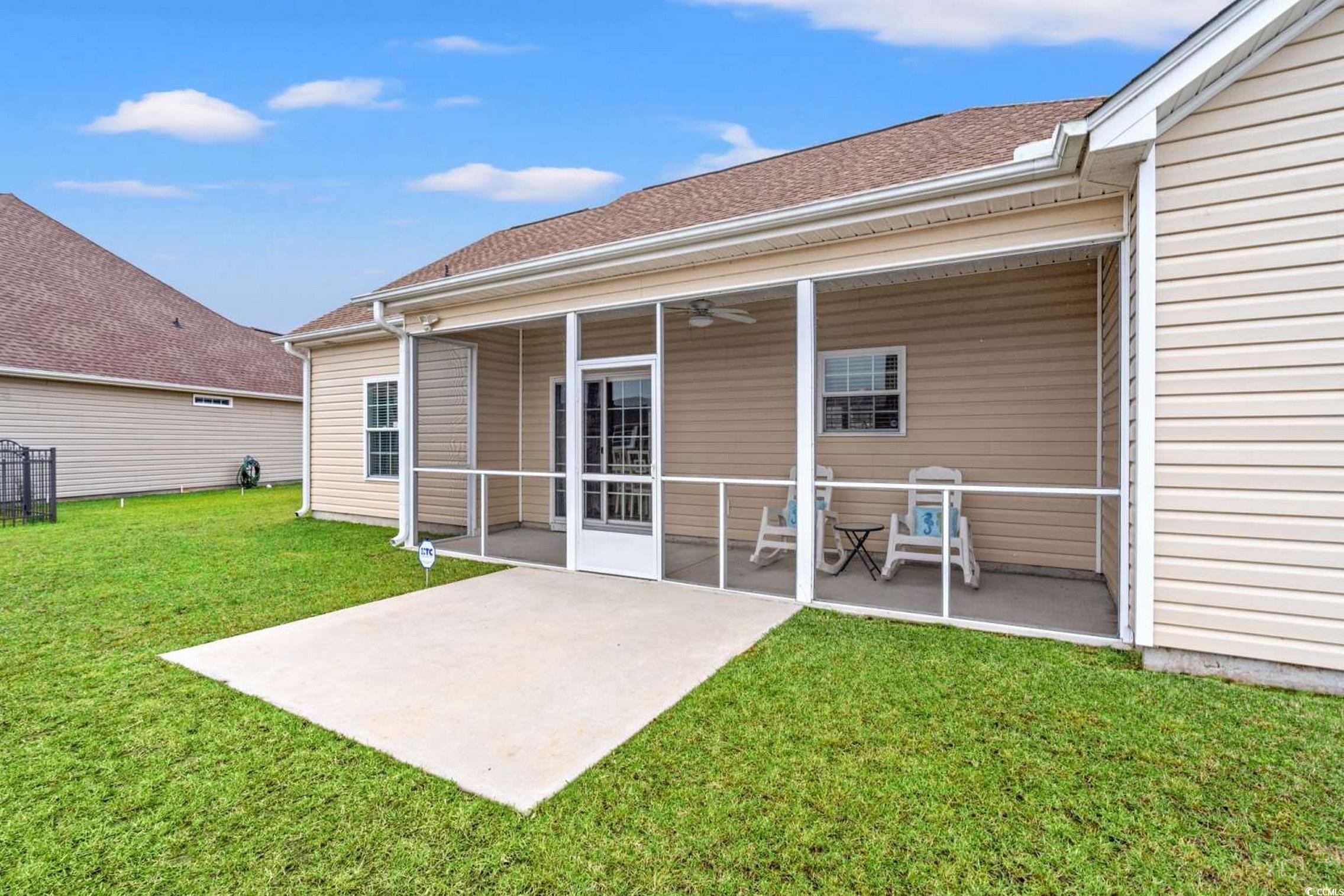 286 Copperwood Loop Conway, SC 29526 - Photo 26 of 40 Rear view of house with ceiling fan, a yard, a sunroom, and roof with shingles