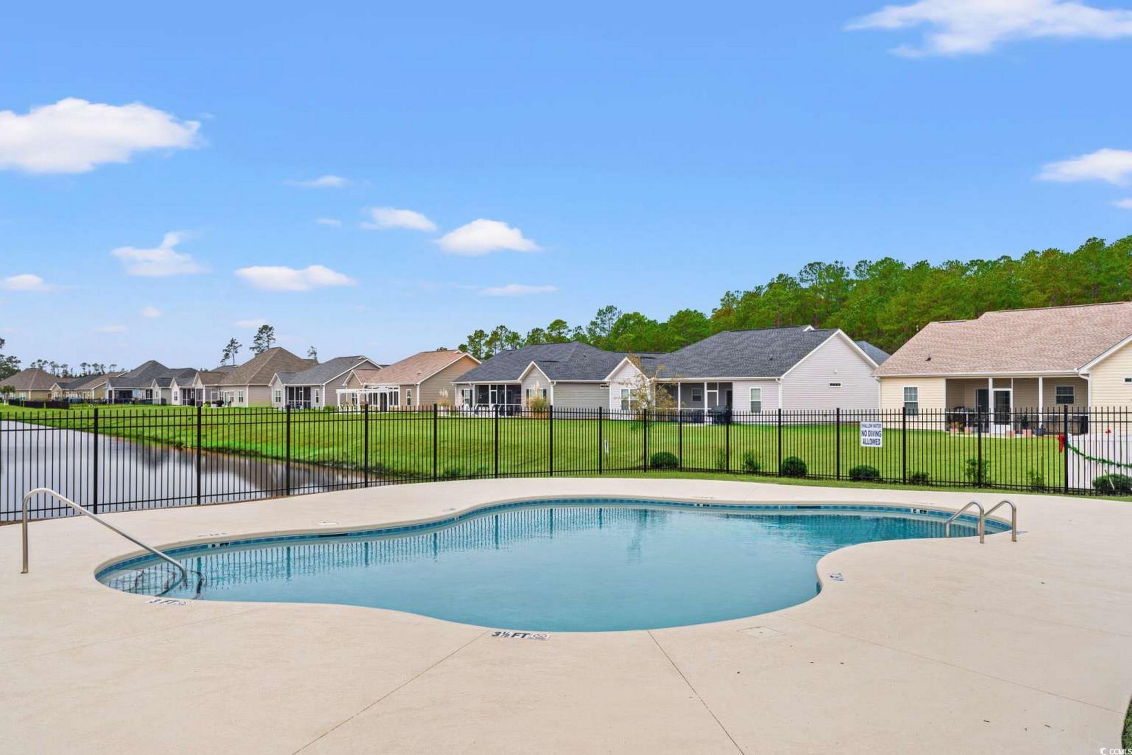 286 Copperwood Loop Conway, SC 29526 - Photo 29 of 40 Community pool featuring a residential view and a patio area