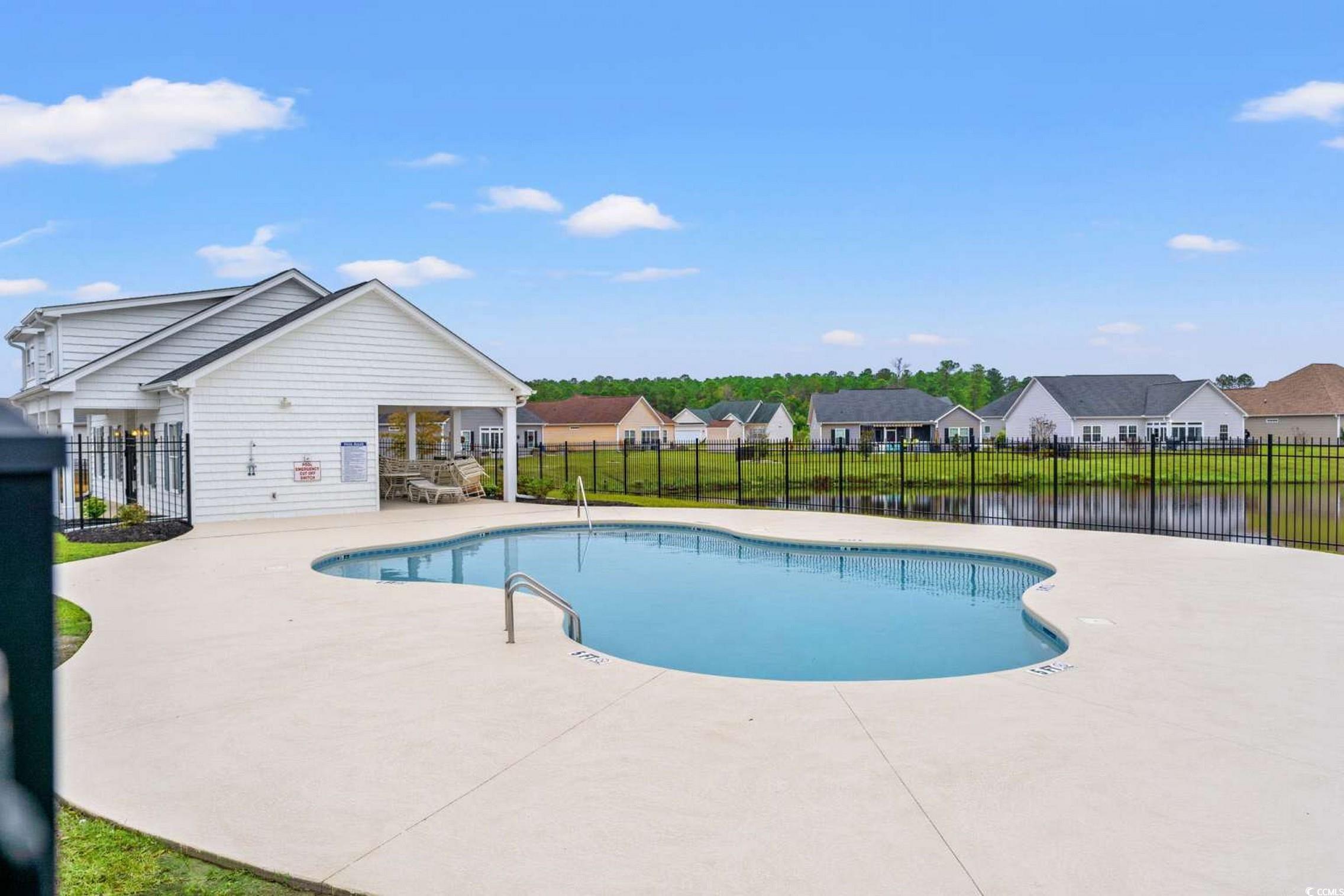 286 Copperwood Loop Conway, SC 29526 - Photo 30 of 40 Community pool featuring a patio and a residential view
