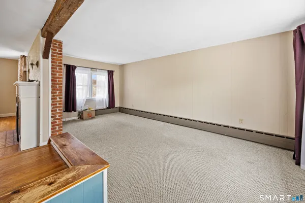 a view of an empty room and window