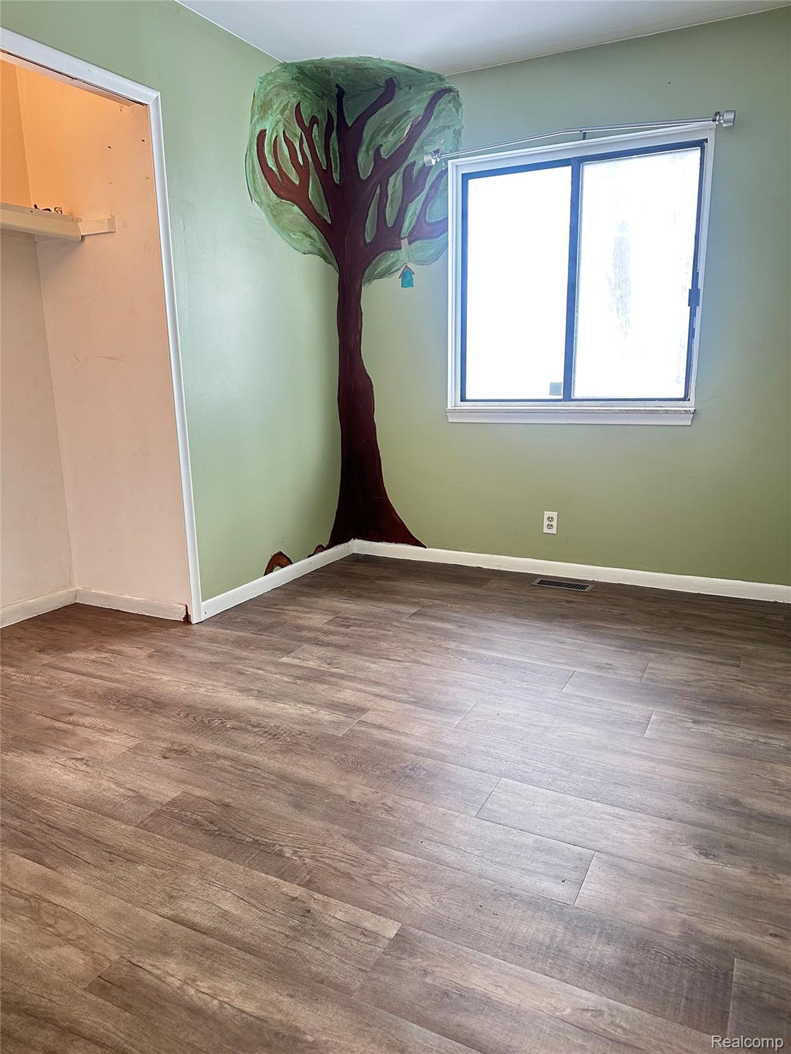 Unfurnished bedroom with LVP flooring