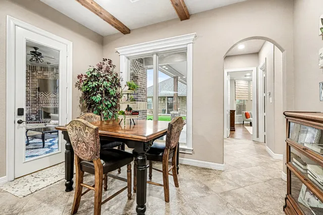 a dining room with furniture and window