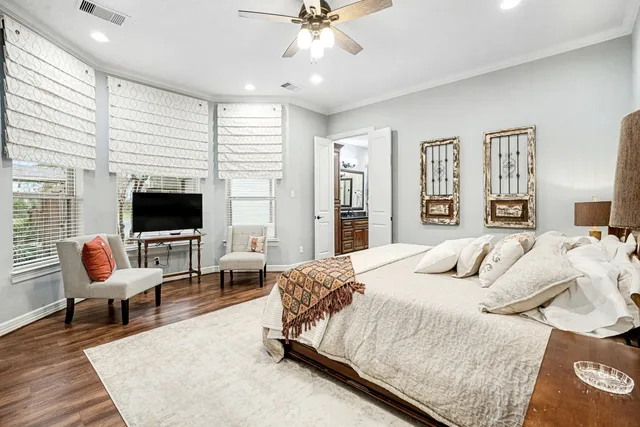 a bedroom with a bed and a couch