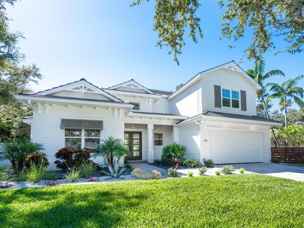 1876 Magnolia Street Sarasota, FL 34239 - Photo 1 of 72 a front view of a house with a yard and potted plants