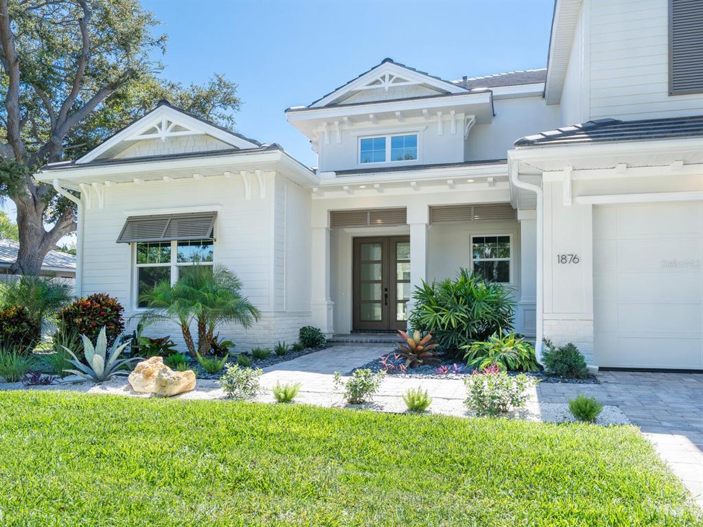 1876 Magnolia Street Sarasota, FL 34239 - Photo 2 of 72 a front view of a house with a yard