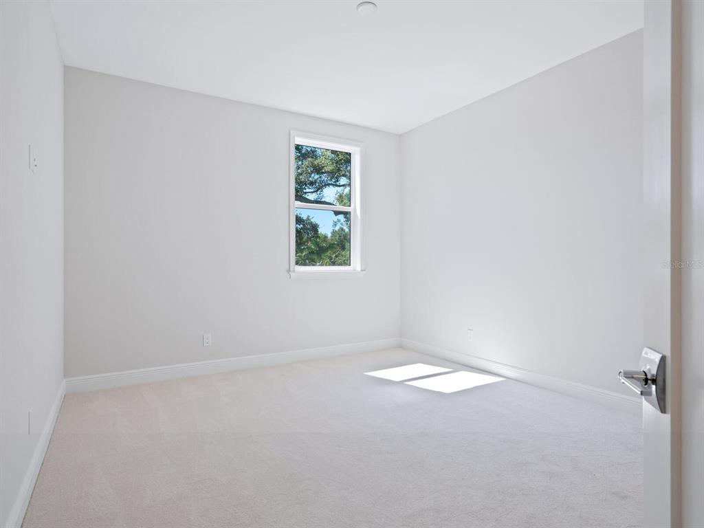 1876 Magnolia Street Sarasota, FL 34239 - Photo 29 of 72 an empty room with windows