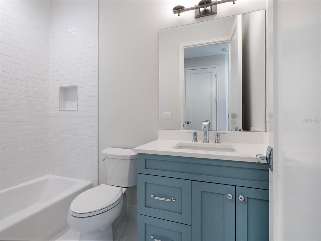 1876 Magnolia Street Sarasota, FL 34239 - Photo 33 of 72 a bathroom with a sink a toilet and shower