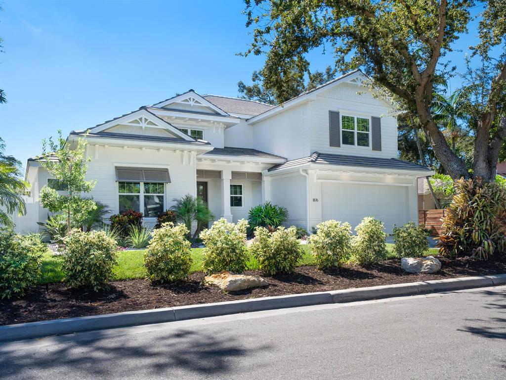1876 Magnolia Street Sarasota, FL 34239 - Photo 4 of 72 front view of a house and a yard