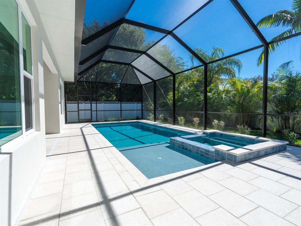 1876 Magnolia Street Sarasota, FL 34239 - Photo 44 of 72 a view of a backyard with table and chairs