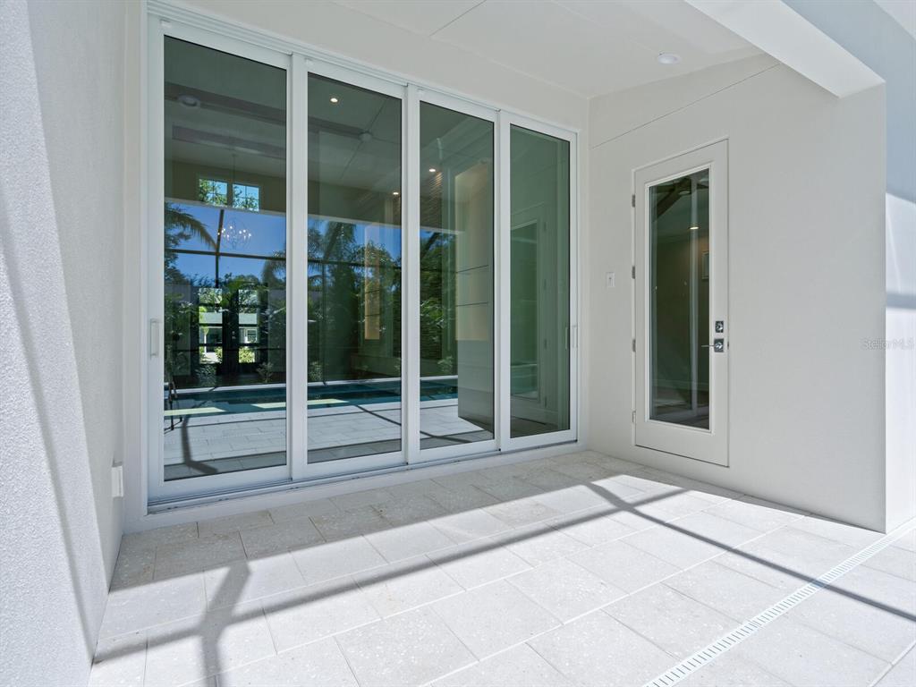 1876 Magnolia Street Sarasota, FL 34239 - Photo 46 of 72 a view of a door with a glass door and a window