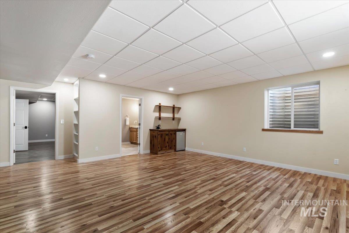 147 East Indian Crk Road Boise, ID 83716 - Photo 25 of 43 Spacious finished basement featuring wood-finish flooring, recessed lighting, and a drop ceiling