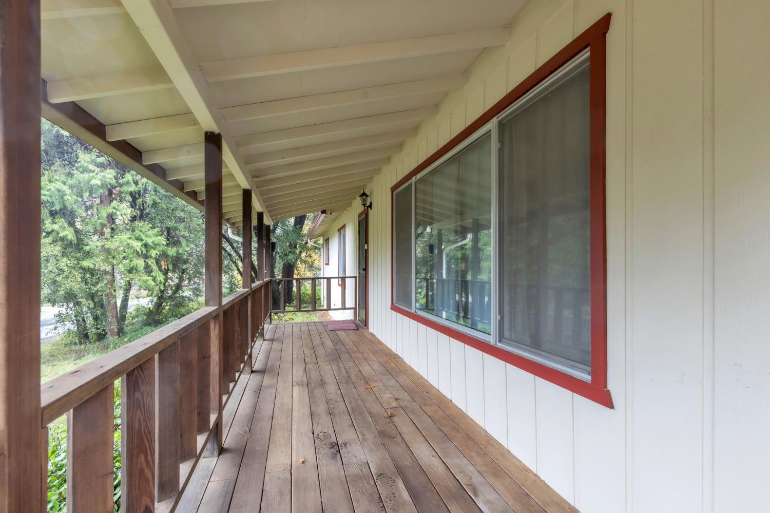 a view of a balcony with wooden floor
