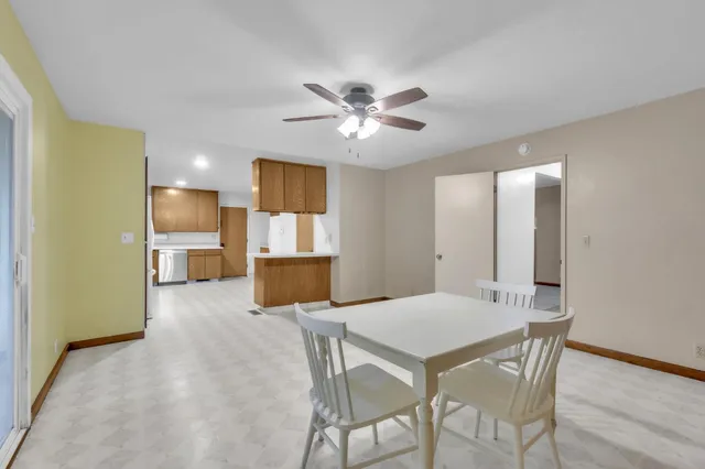 a kitchen with granite countertop cabinets stainless steel appliances and sink