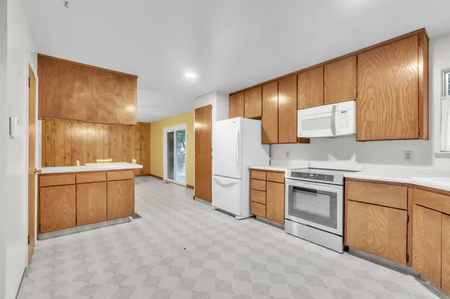 a view of a chairs with wooden fence