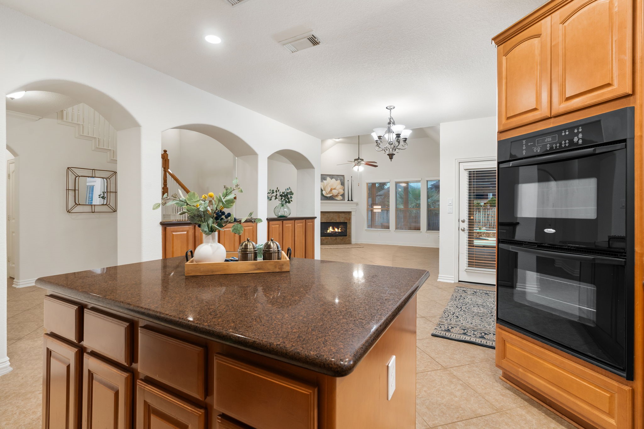 307 Arbor Ridge Lane Conroe, TX 77384 - Photo 17 of 50 a kitchen with a table chairs and kitchen view
