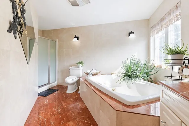 a bath room with a sink and a toilet