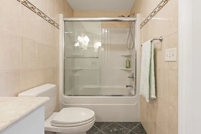 a bathroom with a shower and a toilet