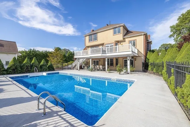 a front view of a house with swimming pool