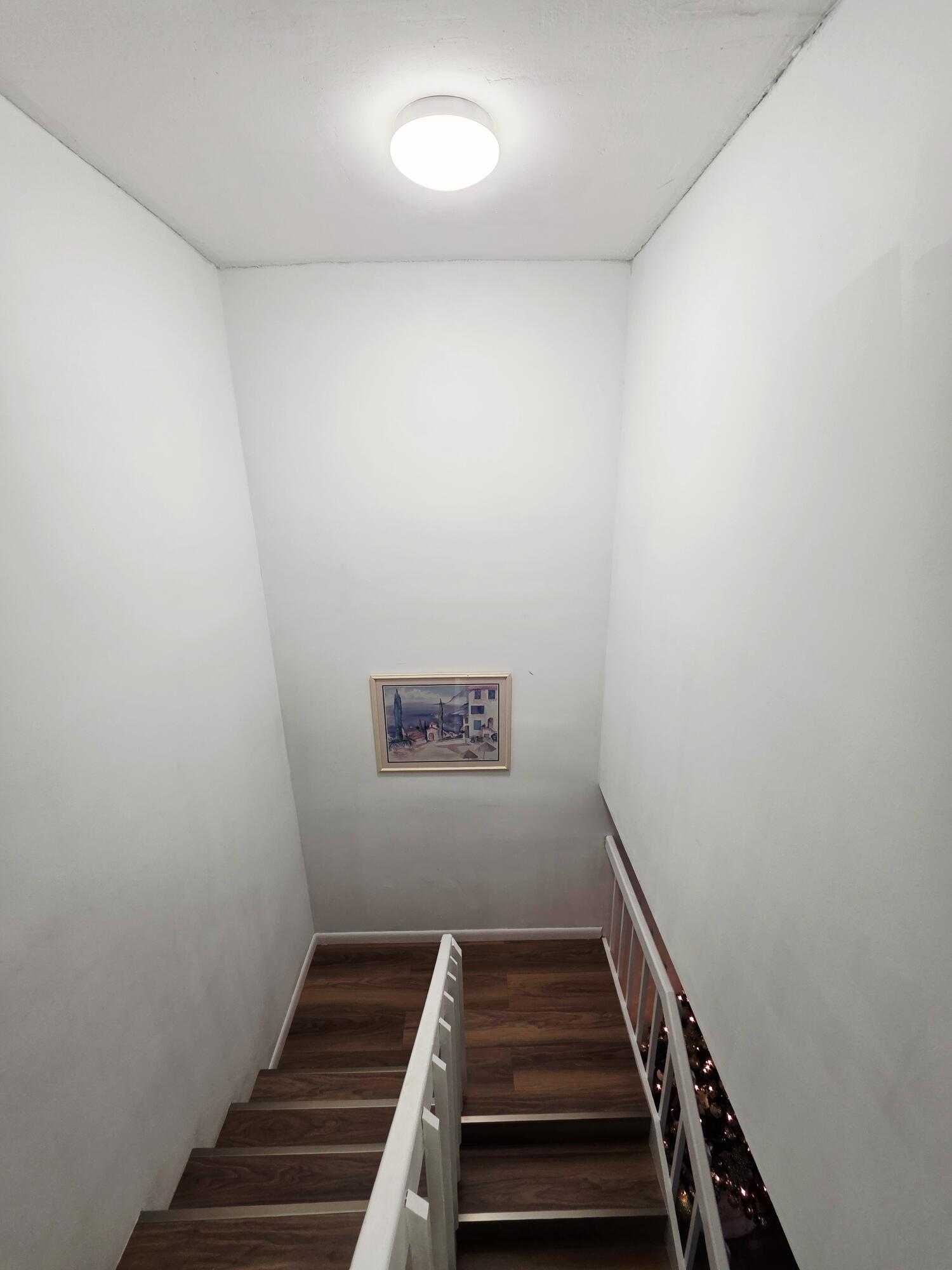 218 Woodland Road Palm Springs, FL 33461 - Photo 15 of 45 a view of an empty room with wooden floor