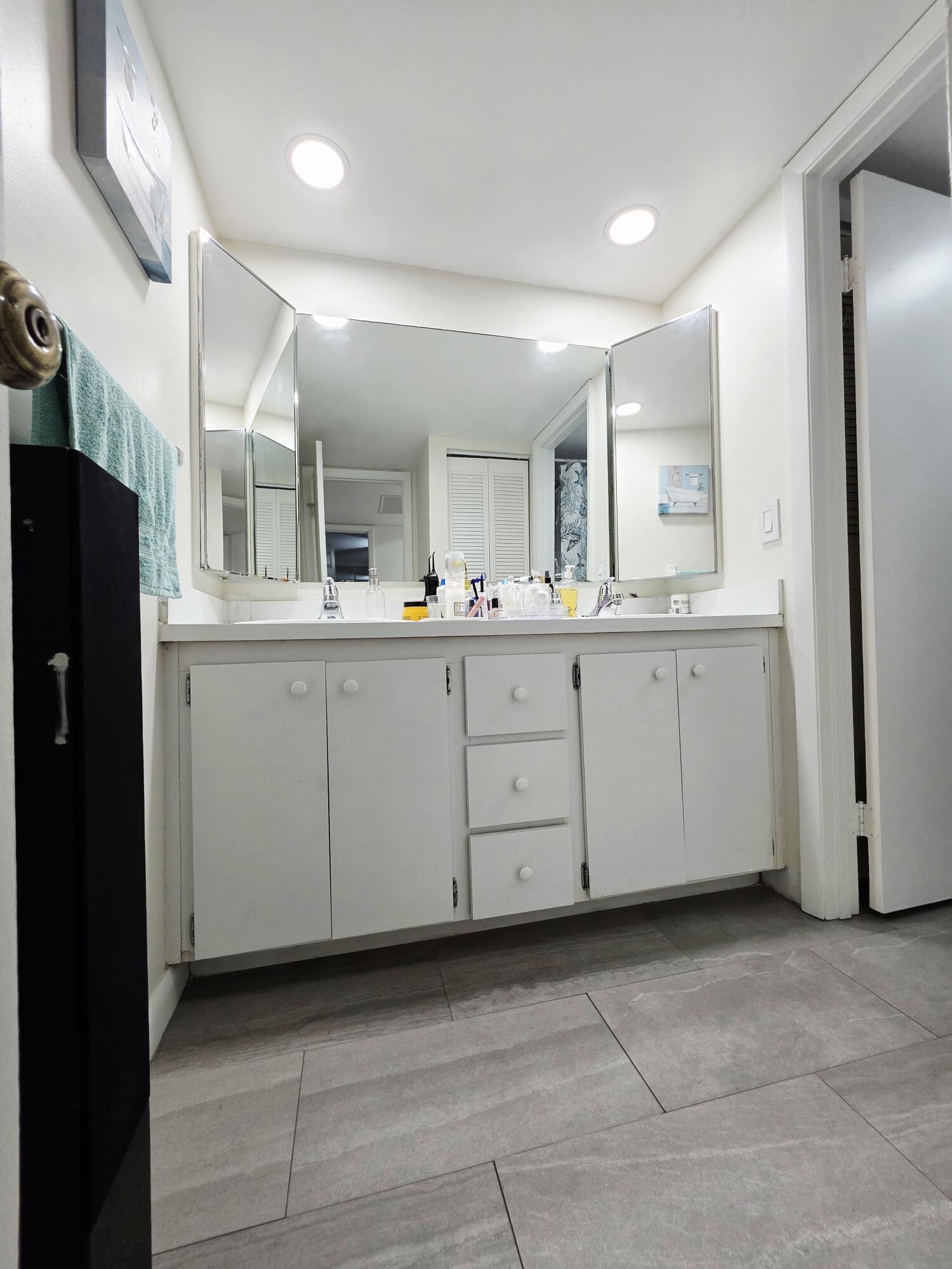 218 Woodland Road Palm Springs, FL 33461 - Photo 17 of 45 a kitchen with sink and cabinets