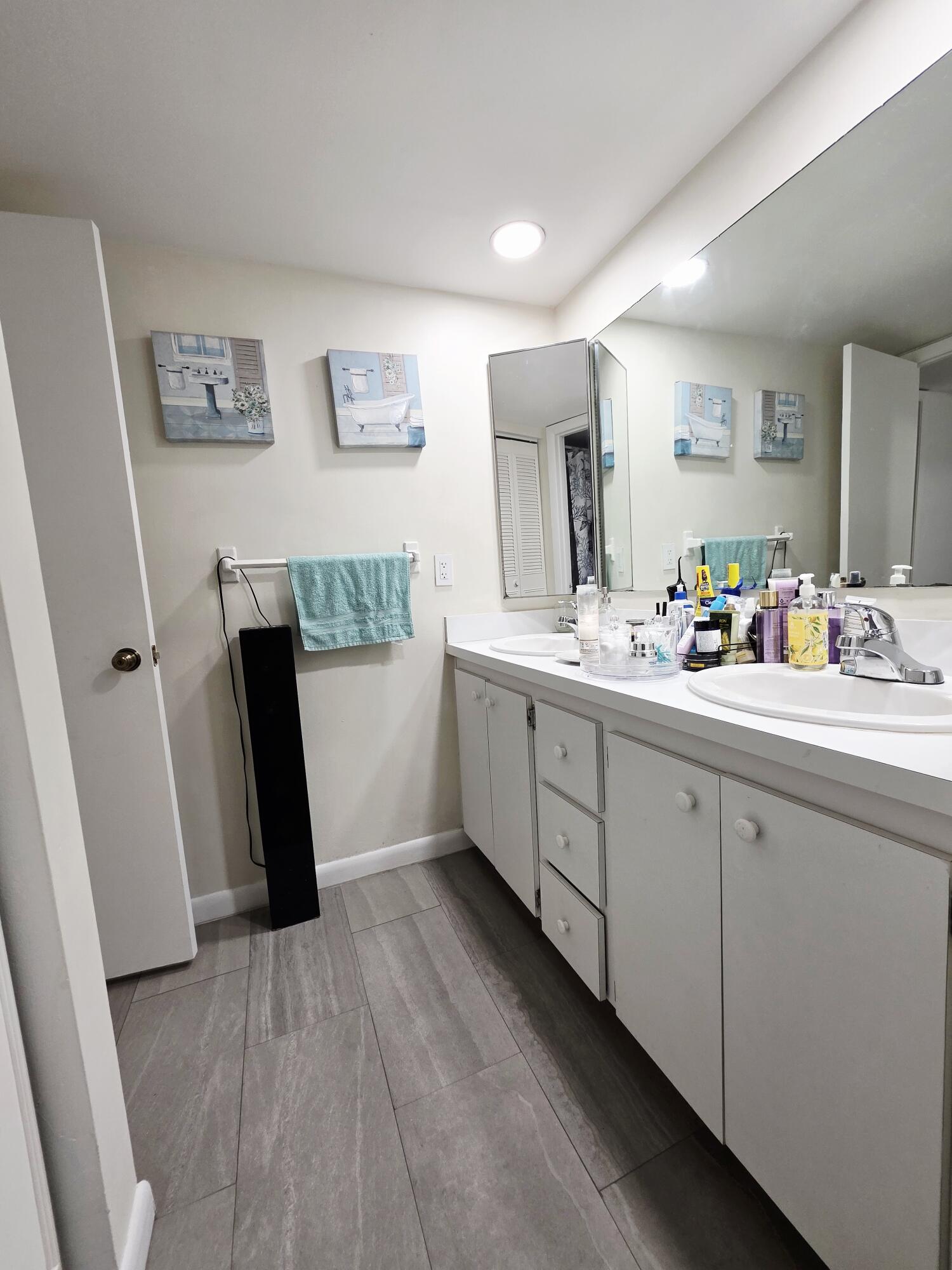 218 Woodland Road Palm Springs, FL 33461 - Photo 18 of 45 a hallway with cabinets and wooden floor
