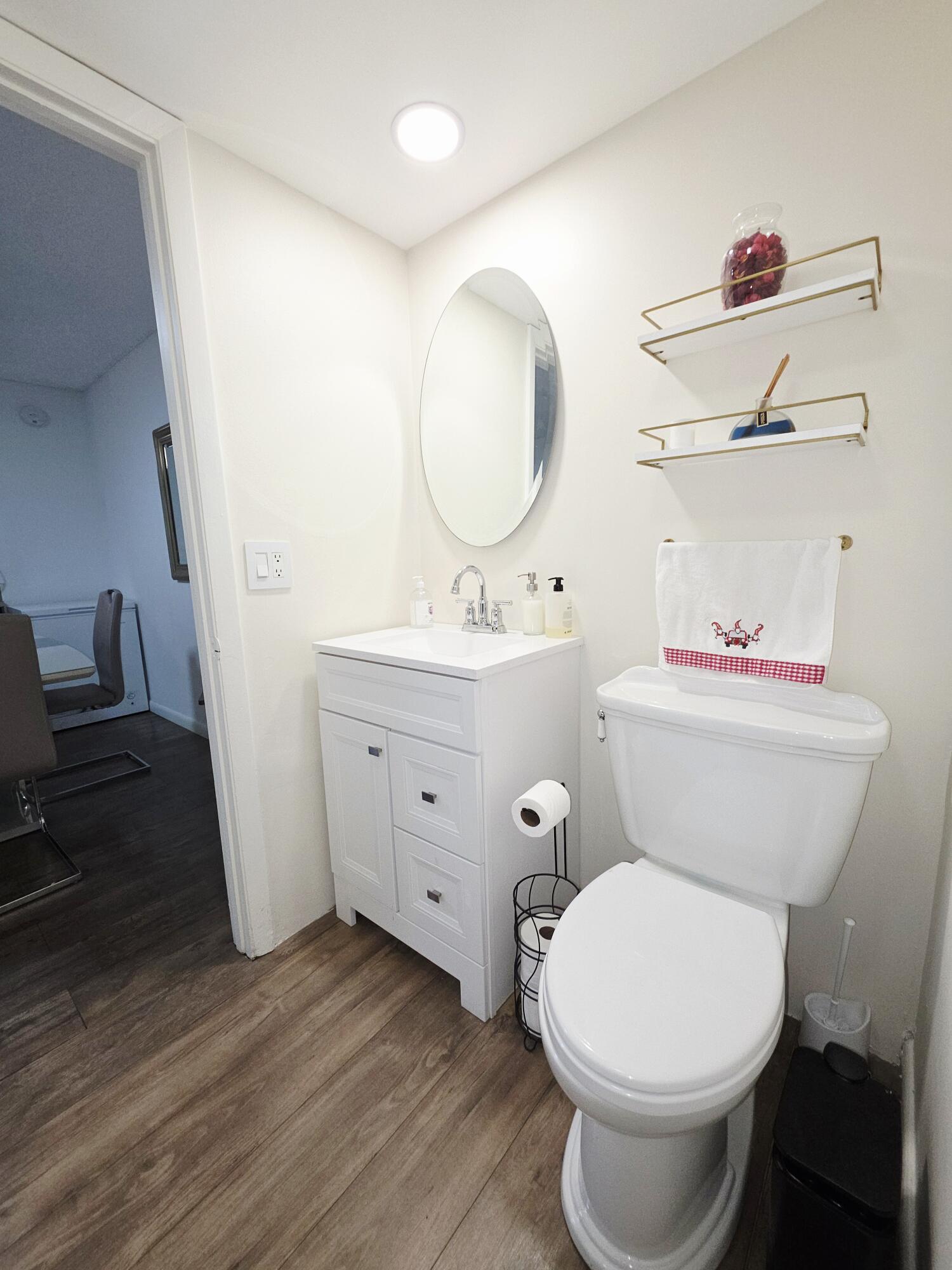 218 Woodland Road Palm Springs, FL 33461 - Photo 21 of 45 a bathroom with a sink mirror vanity and toilet